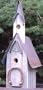 Amish Handcrafted Century Old Barnwood Church Birdhouse. A Unique Sanctuary for Our Feathered Friends. Measures 28" Tall X 12" L X 10" W. Nails Form a Cross Above the Hole and the Perch Is an Authentic Horse Shoe.