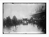 Newswire Photo (S): Roosevelt leaving railroad station Berlin. Crowd, car, and men on horseback.