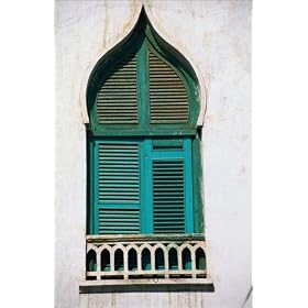 photographie A pointed arch (Arab architecture) shuttered window in the town centre. The town of...