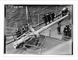 Newswire Photo (L): 5 inch gun