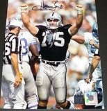 Howie Long Autographed/Hand Signed Oakland Raiders 8x10 Ripped Jersey Photo