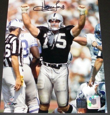 Howie Long Autographed/Hand Signed Oakland Raiders 8x10 Ripped Jersey Photo