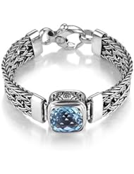 Sterling Silver This stylish sterling silver Sara Blaine bracelet features a 14mm blue topaz.