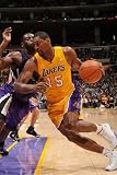 Sacramento Kings v Los Angeles Lakers: Ron Artest and Tyreke Evans Photographic Poster Print by Noah Graham, 16x24
