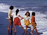 Girls on Lebih Beach, South of Gianyar, Play along the Fringe of Breaking Waves, Indonesia Photographic Poster Print by Adams Gregory, 64x48