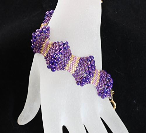 1079. Bead woven bubbles bracelet in purple and gold with a toggle clasp.