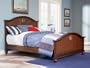 Full Size Bed with Antique Brass Portholes in Antique Honey Brown Oak Finish