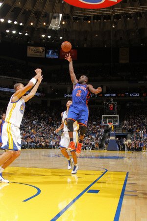 New York Knicks v Golden State Warriors: Raymond Felton and Stephen Curry Photographic Poster Print by Rocky Widner, 8x12