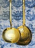 IMAGE OF Wallmonkeys Peel and Stick Wall Decals - Brass Strainers Hanging on a Tile Wall - 48