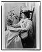 White Nursing Uniforms | Nursing Uniform Dresses | Nursing Student Uniforms | Vintage Nursing Uniforms - Historic Print (L): [Nursing student wearing a starched white uniform, seated in a rocking chair, reading]