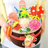 Sassy（サッシー）の虫さんのおもちゃと、パンパースでできたお花畑みたいなおむつケーキ