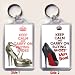 A Large Keyring with KEEP CALM AND CARRY ON BUYING SHOES with a picture of a pair of Jimmy Choo shoes on one side and KEEP CALM AND CARRY ON BUYING MORE SHOES with a picture of a Christian Louboutin shoe with an iconic red sole on the reverse.