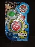 B3 Bakugan Starter Pack - Bakuneon Series- Includes Translucent Ventus Moskeeto, Pyrus Abis Omega and 1 Mystery Aquos Bakugan. The Pack also comes with 3 Ability Cards and 3 Metal Gate Cards