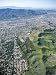 An Aerial View of an Area of Urban Sprawl Encroaching on Mountains Photographic Poste...