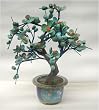 Plum tree with genuine turquoise blossoms, cloisonne pot