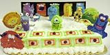 Disney's Monster Inc. Adorable 10 Piece Cake Topper Set Featuring Sulley, Boo, Mike Wazowski, Randall Boggs, Various Monster Birthday Cake Cutouts, CDA- Monster Inc. Characters Range from 2-3 Tall and 2 Monster Inc. Themed Cake Decorations