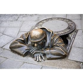 photographie Street art in form of bronze statue called "The Watcher" who appears out of an imagi...