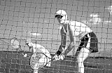 Woman Tennis Players Looking at Camera through Net Waiting to Pl - 24