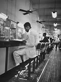 African American Student Virginius B. Thornton During a Sit Down Strike at a Lunch Counter Photographic Poster Print by Howard Sochurek, 18x24