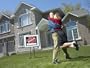 Embracing Young Couple Who Have Just Bought a House Photographic Poster Print, 32x24