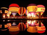 People Watch Hot Air Balloons as They Reflect off the Barigui Lake Associated Press Collection Photographic Poster Print, 64x48