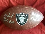 Michael Bush Autographed Oakland Raiders Logo NFL Wilson Composite Football with "Raider Nation" Inscription, Proof Photo of Michael Signing for Us.