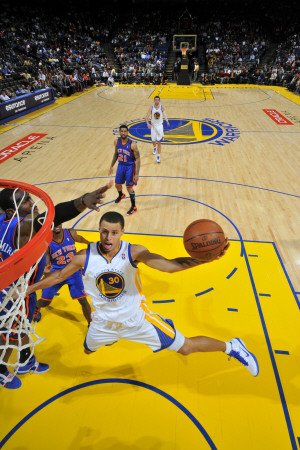 New York Knicks v Golden State Warriors: Stephen Curry Photographic Poster Print by Rocky Widner, 12x18