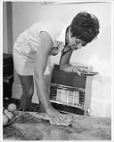 Photographic Print of LADY POLISHES A TABLE from Mary Evans