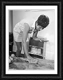 Framed Print of LADY POLISHES A TABLE from Mary Evans