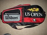 Production Date Unknown: WILSON US OPEN 2-3 Tennis Racquet Bag one zip racket compartment, side pocket + additional mesh zip front pocket. Detachable shoulder strap. Sturdy handle. RED BLACK with YELLOW BALL FLAME. Rare color combo in new condition.