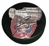 Joe Sakic Autographed Colorado Avalanche Stanley Cup Photo Hockey Puck, Proof Photo of Joe Signing for Us.