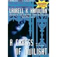 A Caress of Twilight (Meredith Gentry) by Laurell K. Hamilton and Laural Merlington