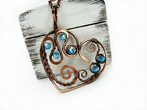 Heart pendant with blue glass bead and copper wire