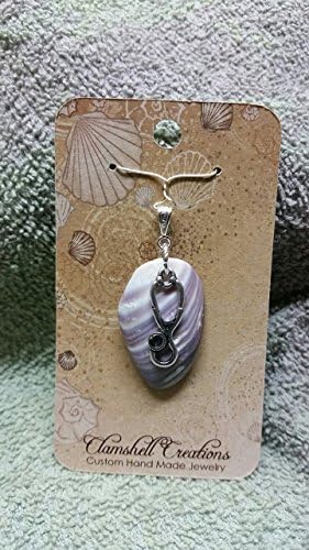 Pendant clam shell with cute Stethoscope.