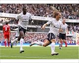 Photographic Prints of Luka Modric celebrates scoring the opening goal against Liverpool from Tottenham Hotspur