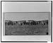 [Group of Native Americans (possibly Winnebago) wearing blankets, some standing befor...