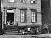 African American Children on Sidewalk in Front of a Tenement Building in the Slums of...