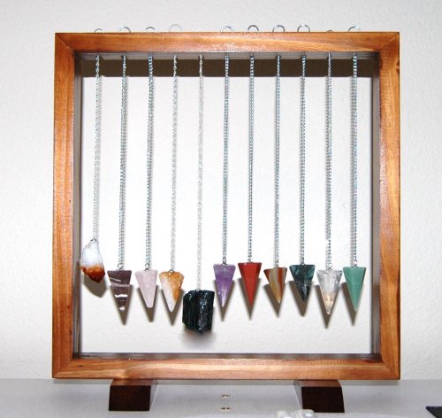 Click here to buy Set of 11 Pendulums in a Wood Frame Display - Rough Citrine, Zebra Stone, Rose Quartz, Citrine,... by ToltecTraders.com.