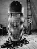 An Atom Smasher Generating an Ion Beam Which Is Carried Below the Floor to the Target Photographic Poster Print by Bernard Hoffman, 18x24