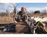 Photographic Prints of An elderly Even woman sewing a tent at a camp near Khailino from ArcticPhoto