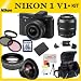 Nikon 1 V1 Mirrorless Digital Camera Kit with 10-30mm and 30-110mm Lenses. Package Includes: Nikon 1 V1 Digital Camera with 10-30mm Lens, 30-110mm Lens, 0.45x Wide Angle Lens, 2x Telephoto Lens, Extended Life Battery, 3 Piece Filter Kit (UV-CPL-FLD), 32 GB SDHC Memory Card, Memory Card Reader, Table Top Tripod, LCD Screen Protectors, Cleaning Kit, Soft Carrying Case