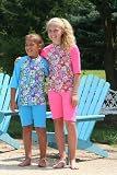 Maximum UV protective short sleeve Rash Guards in child size 6/7. Disco Daisy-Pink. Made in the USA. Sold direct from Manufacturer.