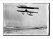 Newswire Photo (L): M. Van den Born flying above the sea. A ship is on the horizon.