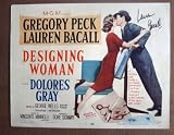DK15 Designing Woman LAUREN BACALL Signed TC Lobby Card.  Here’s a terrific TITLE lobby card from the original release of DESIGNING WOMAN featuring a great image of LAUREN BACALL and GREGORY PECK. This lobby card is autographed by LAUREN BACALL.    Lobby card is in EXCELLENT+ condition. No pinholes, no stains, no tears.       A lobby card is an 11 x 14 inch placard advertising a movie. They were displayed in the theatre lobby to entice moviegoers to go to the box office and buy a ticket.