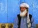 Man Praying in Front of Blue Mosque, Mazar-E Sharif, Balkh, Afghanistan Afghanistan Photographic Poster Print by Stephane Victor, 24x18