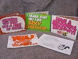 A SET OF 4 ORIGINAL SMELLY GRAME FRAGRANCE CARDS