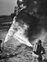 Army Soldiers Demonstrating Newly Developed Flame Throwers That Thrust Flaming Inferno For 35 Yards Photographic Poster Print by Andreas Feininger, 18x24