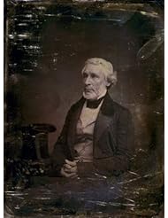 between 1851 and 1852 James Gordon Bennett, three-quarter length portrait, three-quarters to the left, seated, hands folded in lap, seated beside a small table with tablecloth on which rests a tall hat SUMMARY: Editor of the New York Herald. Vintage Black & White Photograph