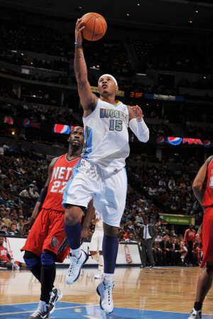 New Jersey Nets v Denver Nuggets: Carmelo Anthony and Johan Petro Photographic Poster Print by Garrett Ellwood, 8x12
