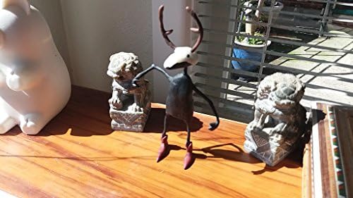 Crocodile wearing dear skull mask